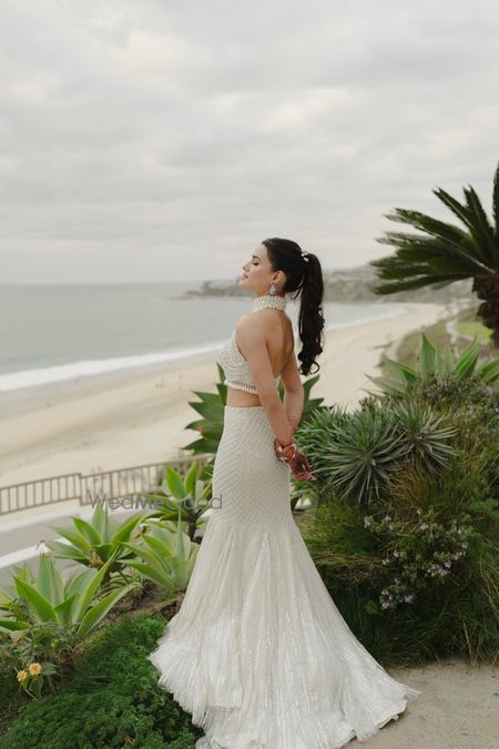 Photo of Sangeet look in an all-white lehenga with pearl work all over and a mermaid style cut lehenga
