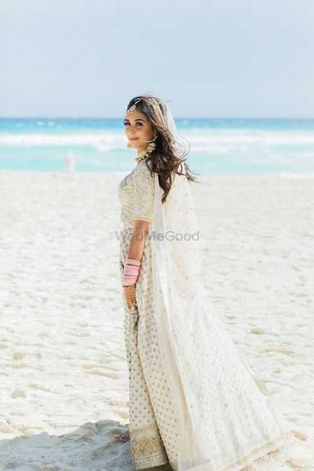 Photo of Beach wedding with bride in white