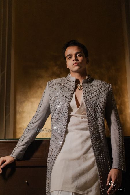 Photo of Unique light grey jacket style kurta set for groom in mirror work for the sangeet night