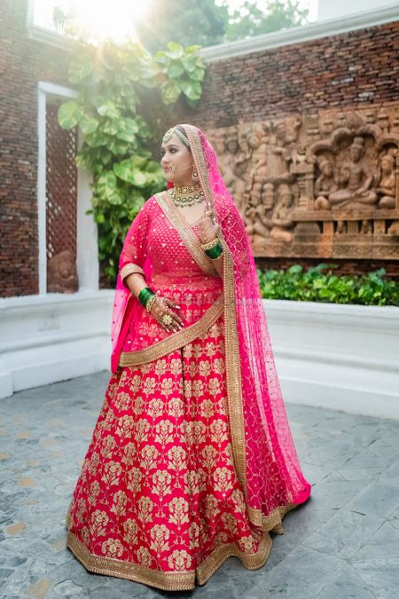 Bride in a timeless pink wedding lehenga 