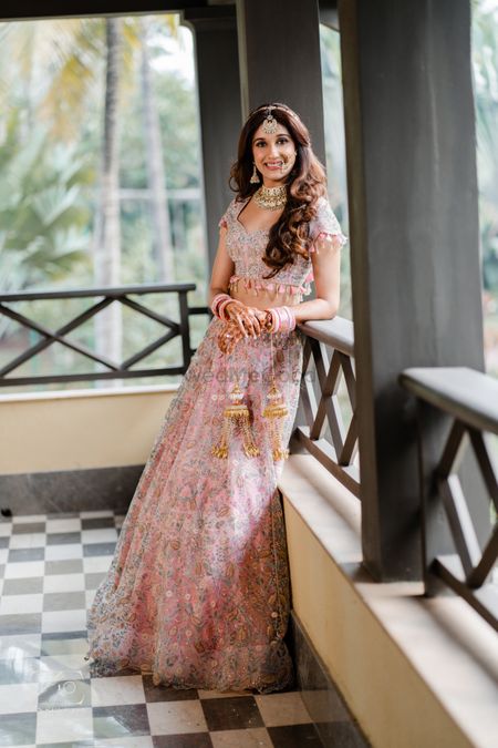 Photo of Bride in a pastel lehenga with all over embroidery