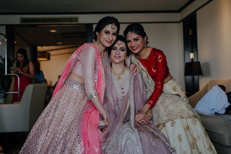 Photo of The bride with her sisters right before she ties the knot