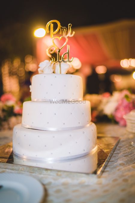 Three tier white engagement cake with personalised topper