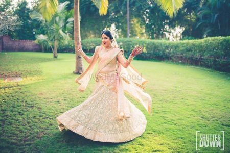 Twirling bride in pastel