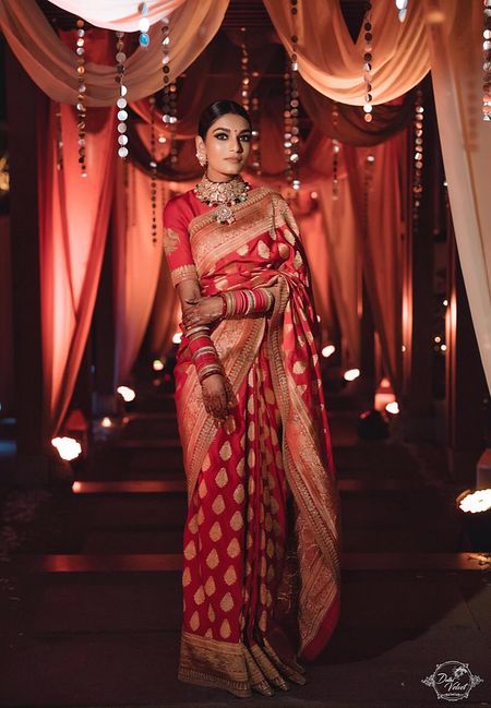 An elegant bride in a stunning silk saree. 