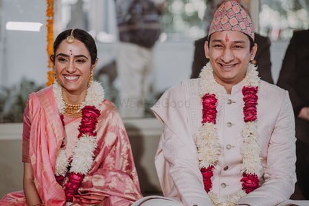 Photo of bright and happy couple portrait wearing varmalas