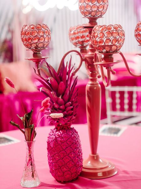 spray painted pink pineapple in table setting