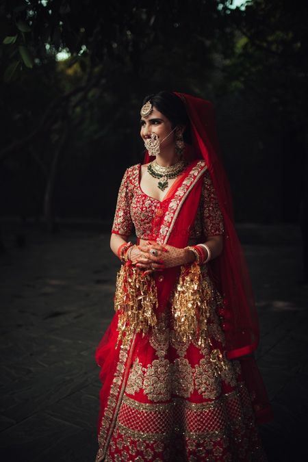 Photo of Bridal portrait of bride in red