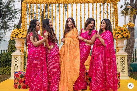 Photo of bride and bridesmaids on haldi in bandhani sarees