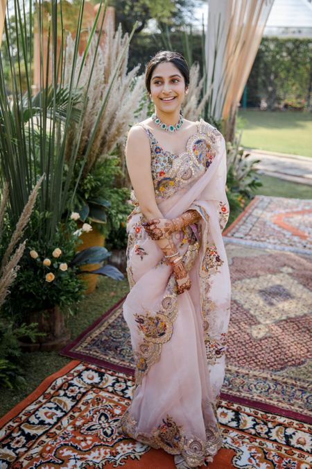 Bride dressed in an organza saree for her brunch.