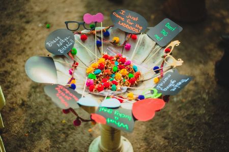 Photo of Pom poms and callouts for mehendi decor