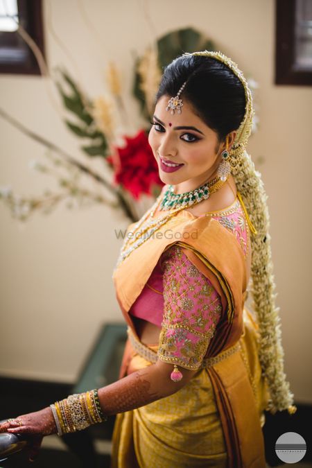South Indian bridal look with gold kanjivaram and pink blouse