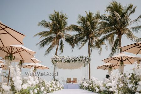 Photo of Gorgeous all white floral madap with a floral aisle for a beach side wedding