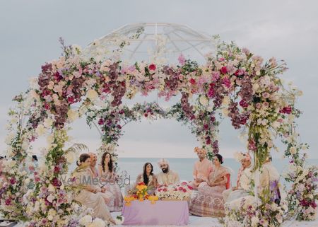 Gorgeous floral mandap with dome style outdoor decor in pink and pastel florals