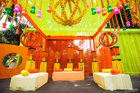yellow and orange mehendi decor by Stallion Events Amritsar