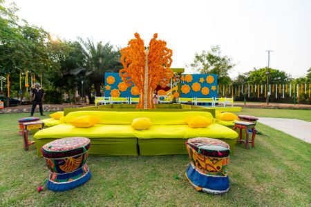 Photo of floral colourful mehendi seating idea