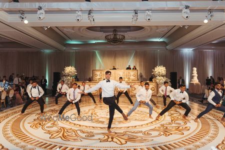 Fun shot of the groom and his groomsmen dancing on the sangeet night