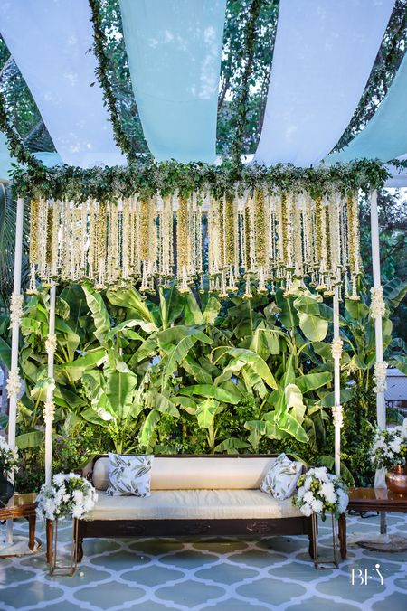 beautiful mehendi stage with hanging floral decor