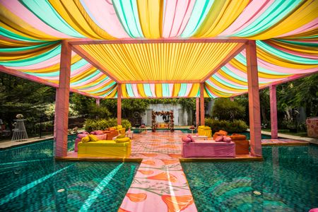 Colorful mehendi decor ideas for a pool-side celebration