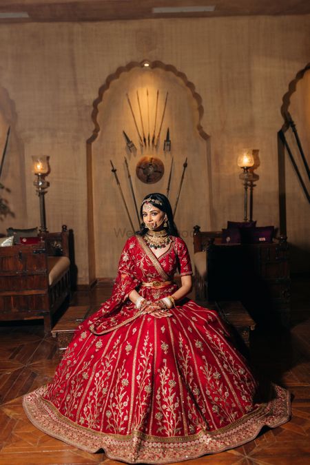 Photo of Bride in royal red lehenga