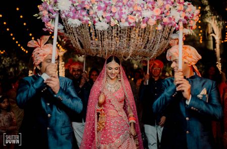 Pretty bridal entry under phoolon ki chaadar