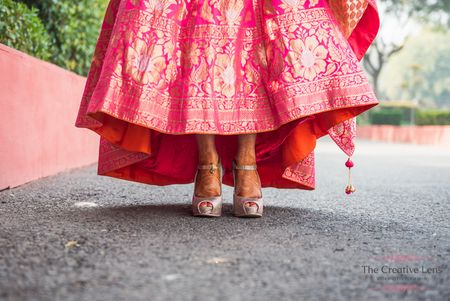 Pink banarsi bridal lehenga with silver peeptoe shoes