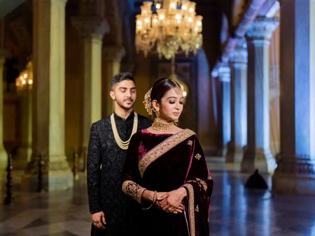 bride and groom in royal outfits for reception