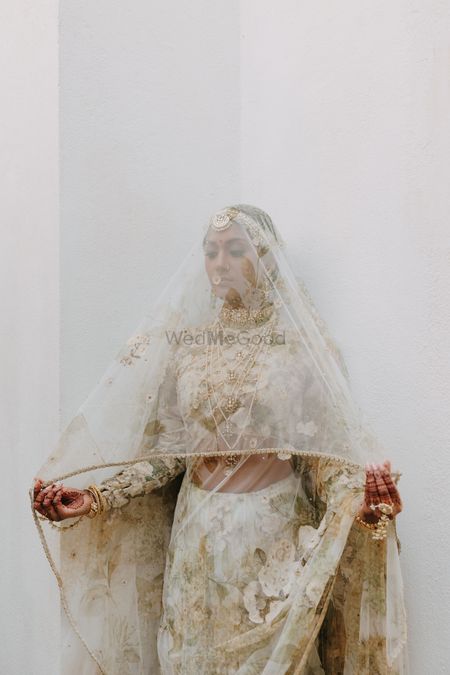 Photo of Bride under veil shot