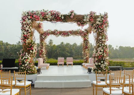 Gorgeous and rustic wedding mandap with floral decor for a day wedding 