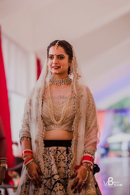 Photo of Bridal look in gold and maroon lehenga