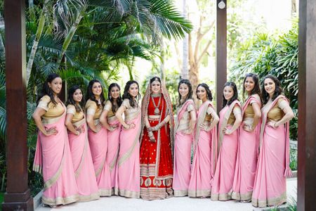 Photo of Bride with her tribe of bridesmaids.