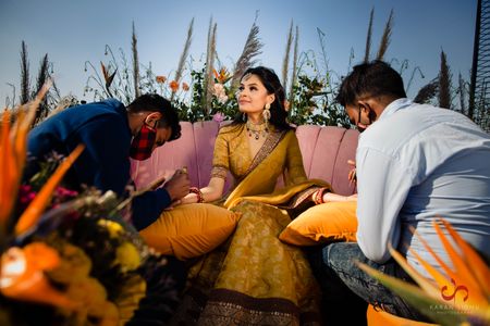 Bride on mehendi day in a Sabyasachi lehenga