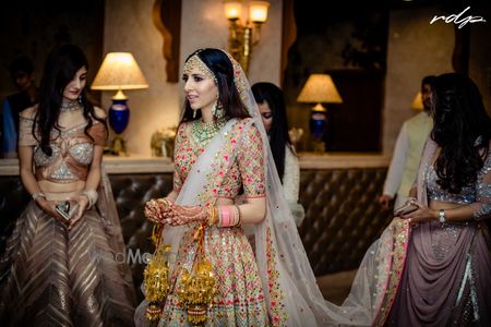 Photo of Bride and bridesmaids entering shot