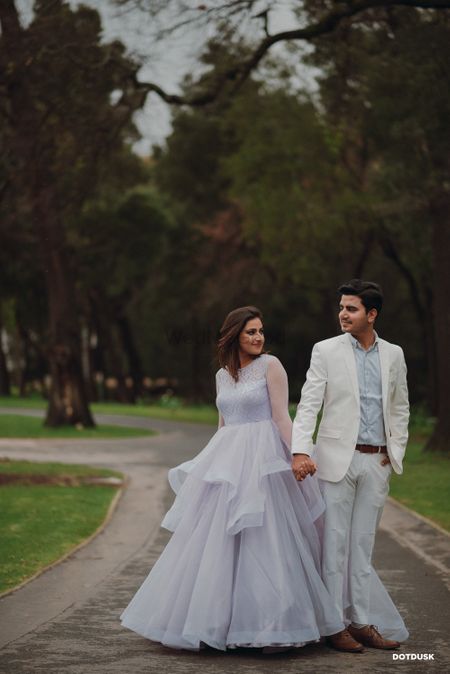 Photo of Matching bride and groom in engagement clothes