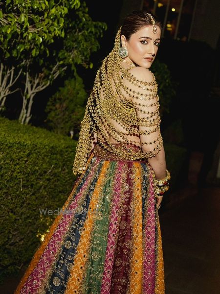 Unique mirror cape style blouse for the mehendi with a colourful panelled lehenga