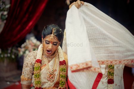 Photo of A to-be south Indian bride wearing a saree with a kamarbandh,  posing with