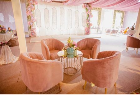 seating idea for wedding with pastel decor and sofas