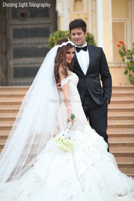 Christian Bride in White Ruffled Wedding Gown