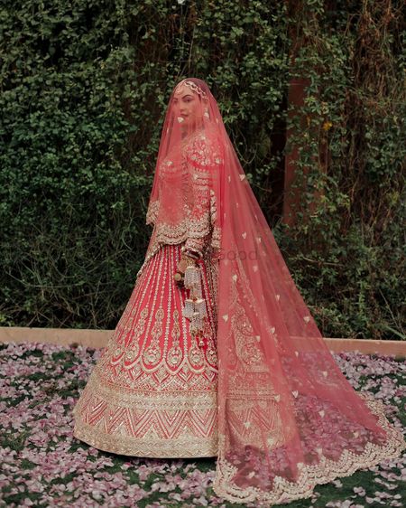 Photo of bride in pink lehenga