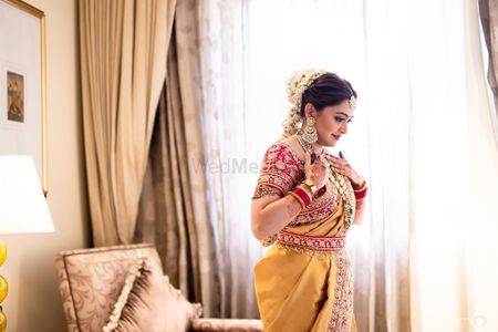 Fusion bridal look in yellow saree and floral jada