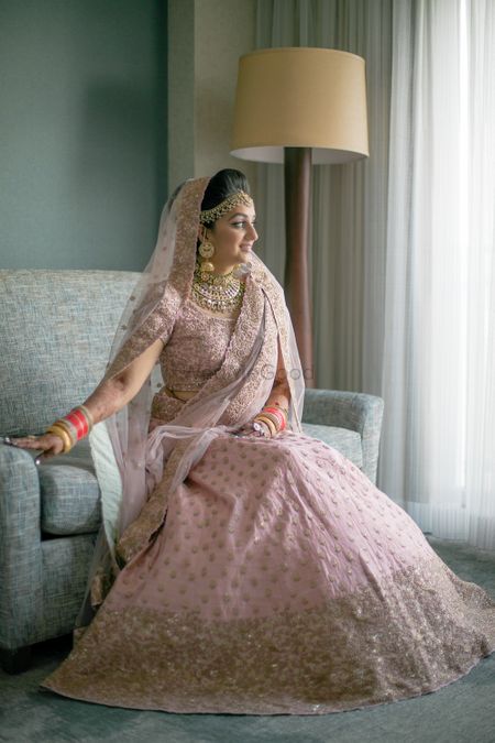 Photo of Blush pink and gold lehenga with broad border