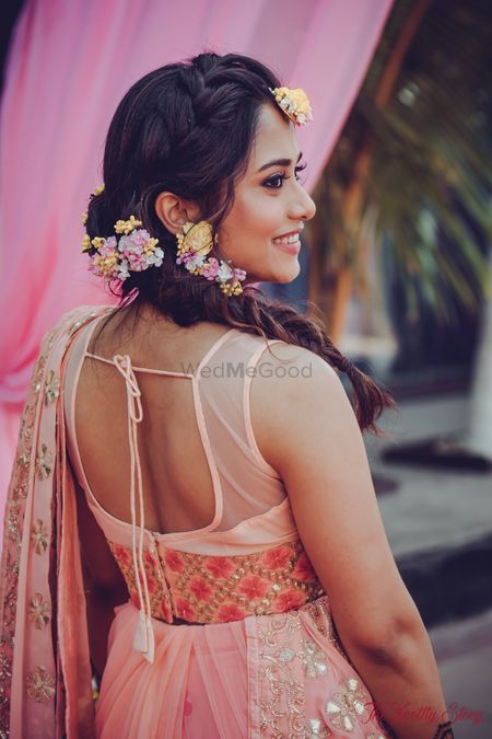 Mehendi look with floral braided hair