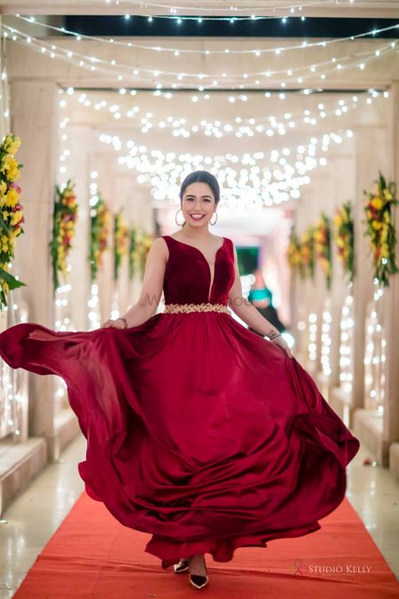 maroon gown for bride with a gold belt 