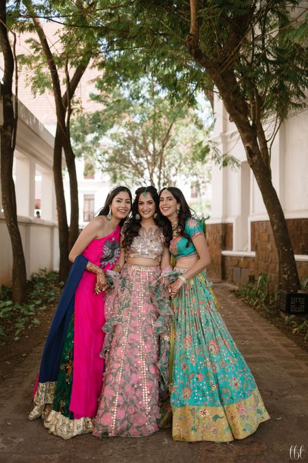 bride with her bridesmaids on her mehendi