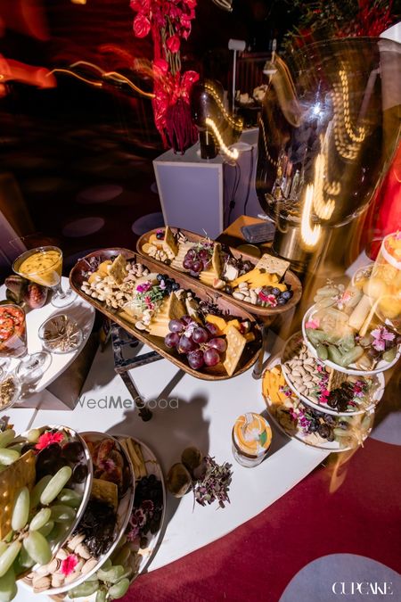 Fun charcuterie board with fruits, cheese and crackers on display 