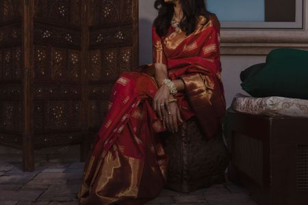 red and gold saree bride wore for the pooja