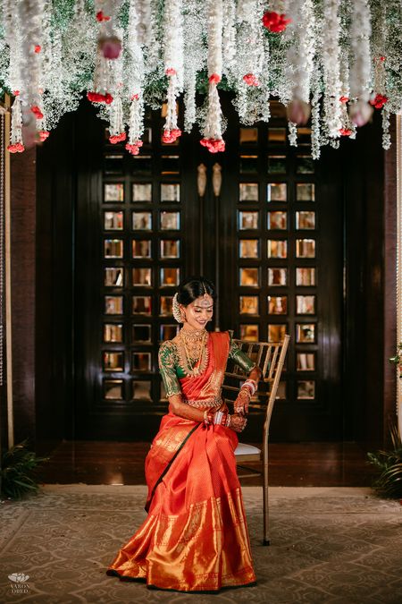 Bride in an orange kanjivaram 