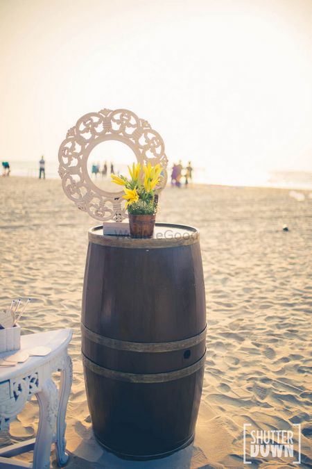 Wooden barrel prop in beach wedding