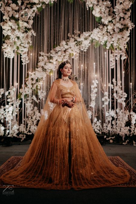 Photo of bride wore stunning gold lehenga for engagement