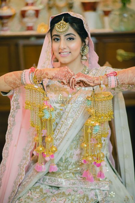 Photo of Bride with unique Chura and kaleere